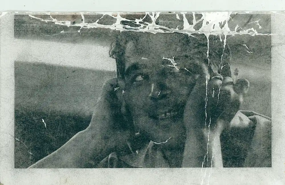 Damaged portrait before restoration